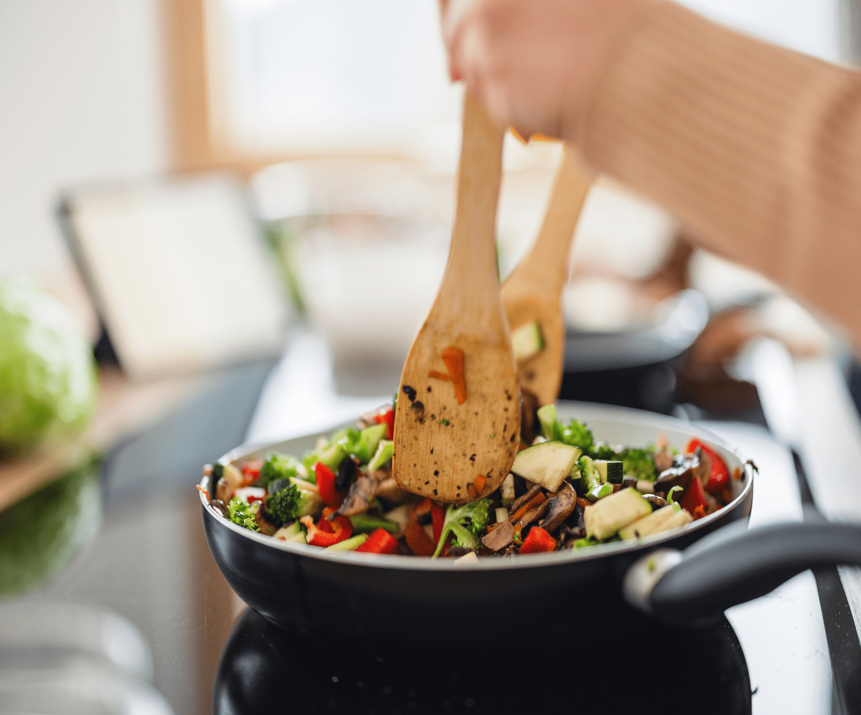 Cooking vegetables in a frying pan
